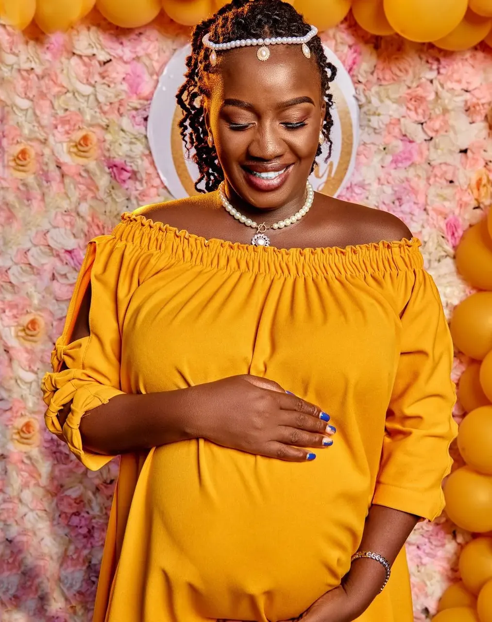 Maternity photoshoot in Mombasa: expectant mother in a yellow dress