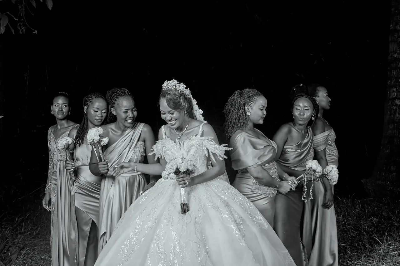 Black and white wide shot of the bride and her bridal party